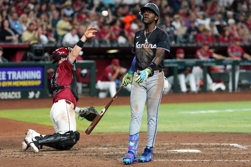 May 25, 2024; Phoenix, Arizona, USA; Miami Marlins outfielder Jazz Chisholm Jr. (2) reacts after striking out against the Arizona Diamondbacks during the ninth inning at Chase Field. Mandatory Credit: Joe Camporeale-USA TODAY Sports