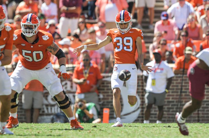 Sep 23, 2023; Clemson, South Carolina, USA; Clemson Tigers punter Aidan Swanson (39) punts against the Florida State Seminoles during the third quarter at Memorial Stadium. Mandatory Credit: Ken Ruinard-USA TODAY Sports