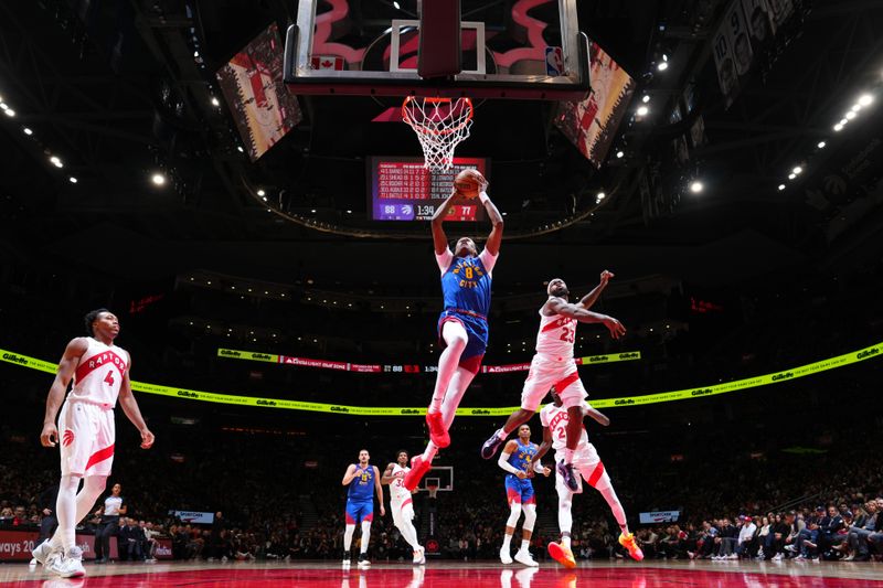 TORONTO, CANADA - OCTOBER 28: Peyton Watson #8 of the Denver Nuggets dunks the ball during the game against the Toronto Raptors on October 28, 2024 at the Scotiabank Arena in Toronto, Ontario, Canada.  NOTE TO USER: User expressly acknowledges and agrees that, by downloading and or using this Photograph, user is consenting to the terms and conditions of the Getty Images License Agreement.  Mandatory Copyright Notice: Copyright 2024 NBAE (Photo by Mark Blinch/NBAE via Getty Images)