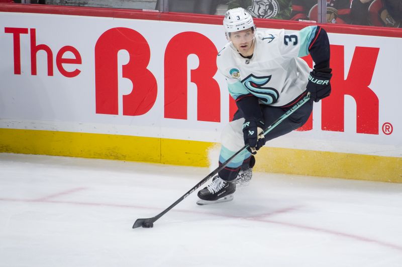 Nov 2, 2024; Ottawa, Ontario, CAN; Seattle Kraken defenseman Will Borgen (3) skates with the puck in the third period against the Ottawa Senators at the Canadian Tire Centre. Mandatory Credit: Marc DesRosiers-Imagn Images