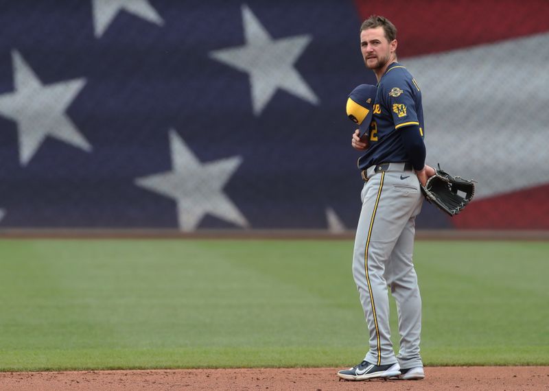 May 25, 2025; Pittsburgh, Pennsylvania, USA;  Milwaukee Brewers second baseman Brice Turang (2) stands for the playing of God Bless America during the seventh inning stretch against the Pittsburgh Pirates at PNC Park. Mandatory Credit: Charles LeClaire-Imagn Images