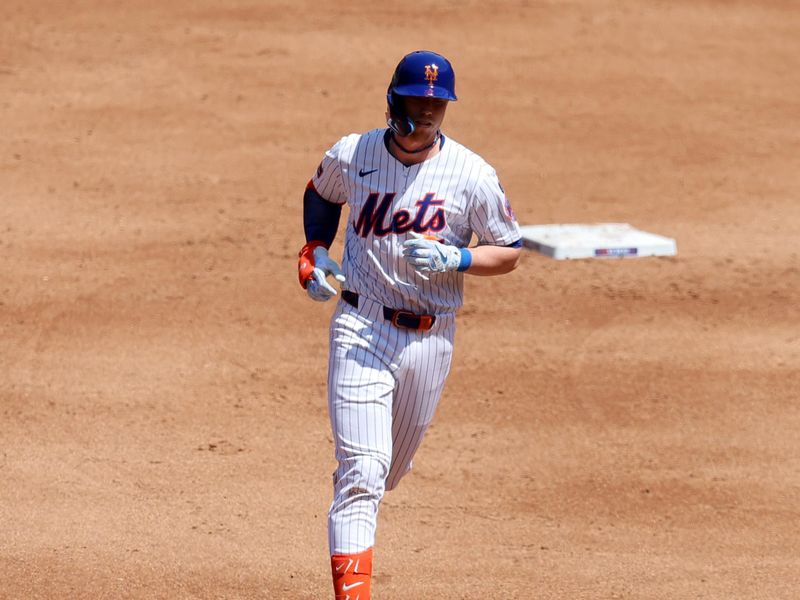 Apr 23, 2025; New York City, New York, USA; New York Mets second baseman Brett Baty (7) rounds the bases after hitting a two run home run against the Philadelphia Phillies during the second inning at Citi Field. Mandatory Credit: Brad Penner-Imagn Images