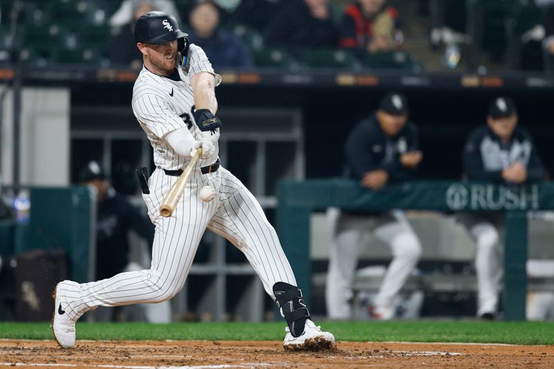 Jun 4, 2025; Chicago, Illinois, USA; Chicago White Sox first baseman Tim Elko (30) singles against the Detroit Tigers during the fourth inning at Rate Field. Mandatory Credit: Kamil Krzaczynski-Imagn Images
