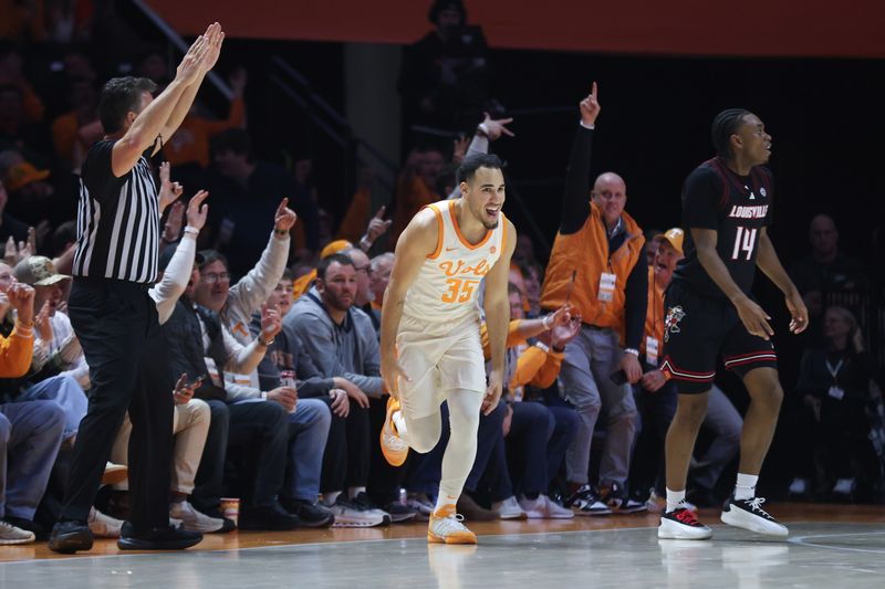 Dec 16, 2025; Knoxville, Tennessee, USA;  Tennessee Volunteers guard Ethan Burg (35) reacts after scoring a three  point shot against the Louisville Cardinals during the second half at Thompson-Boling Arena at Food City Center. Mandatory Credit: Randy Sartin-Imagn Images
