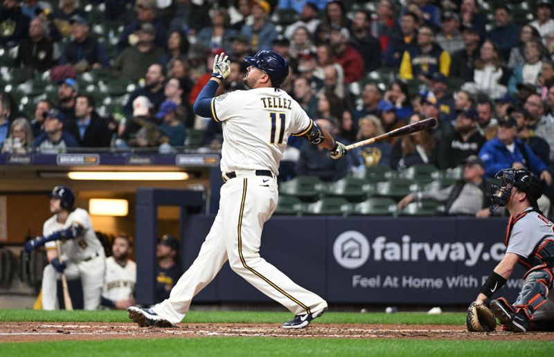 Apr 25, 2023; Milwaukee, Wisconsin, USA;  Milwaukee Brewers first baseman Rowdy Tellez (11) hits a solo home run in the sixth inning against the Detroit Tigers at American Family Field. Mandatory Credit: Michael McLoone-USA TODAY Sports