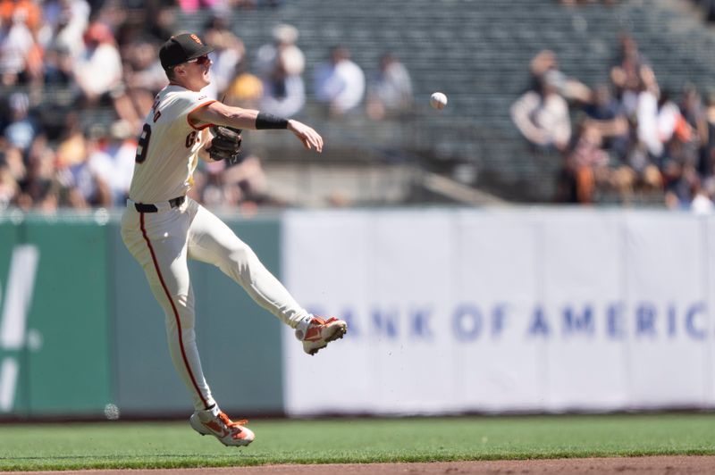 Sep 5, 2024; San Francisco, California, USA;  San Francisco Giants shortstop Tyler Fitzgerald (49) throws the ball to first base during the first inning against the Arizona Diamondbacks at Oracle Park. Mandatory Credit: Stan Szeto-Imagn Images