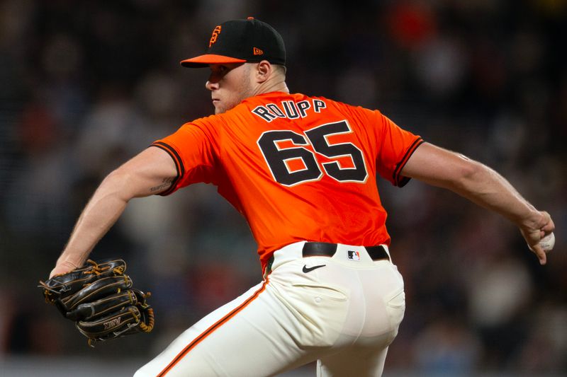 Sep 27, 2024; San Francisco, California, USA; San Francisco Giants starting pitcher Landen Roupp (65) delivers a pitch against the St. Louis Cardinals during the second inning at Oracle Park. Mandatory Credit: D. Ross Cameron-Imagn Images