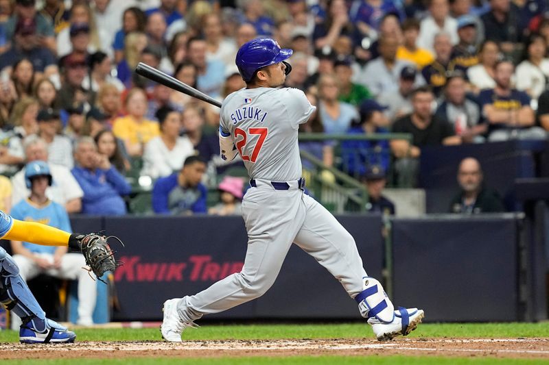 Jun 28, 2024; Milwaukee, Wisconsin, USA;  Chicago Cubs designated hitter Seiya Suzuki (27) hits a home run during the fourth inning against the Milwaukee Brewers at American Family Field. Mandatory Credit: Jeff Hanisch-USA TODAY Sports