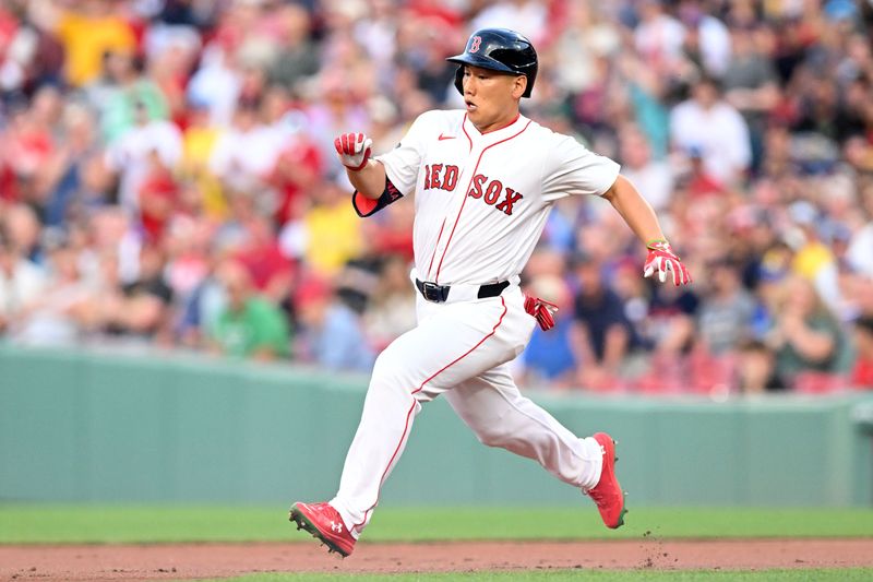 Jun 25, 2024; Boston, Massachusetts, USA; Boston Red Sox left fielder Masataka Yoshida (7) runs to second base after hitting a RBI double against the Toronto Blue Jays during the second inning at Fenway Park. Mandatory Credit: Brian Fluharty-USA TODAY Sports