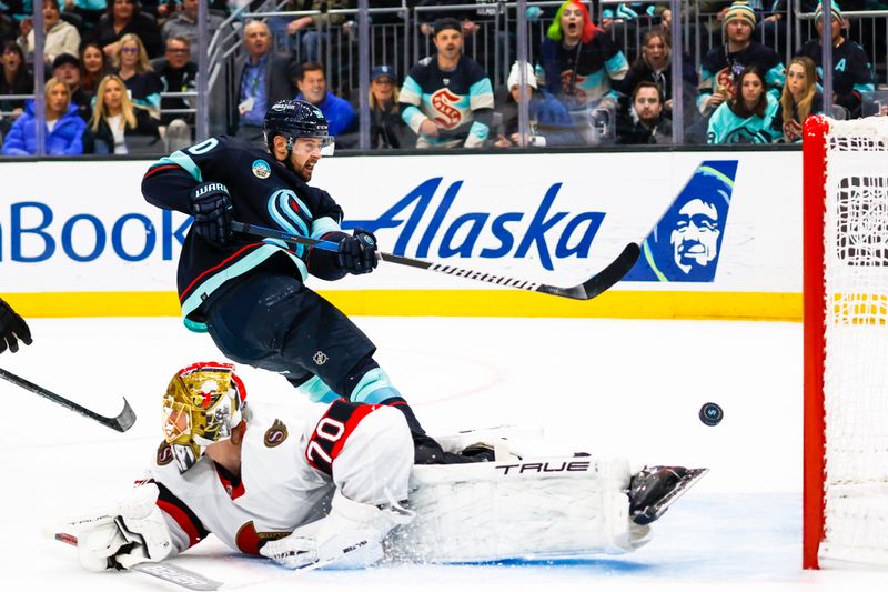 Jan 4, 2024; Seattle, Washington, USA; Seattle Kraken left wing Tomas Tatar (90) scores a goal against Ottawa Senators goaltender Joonas Korpisalo (70) during the second period at Climate Pledge Arena. Mandatory Credit: Joe Nicholson-USA TODAY Sports