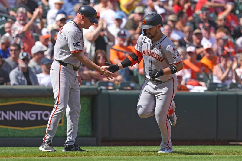 Sep 19, 2024; Baltimore, Maryland, USA; San Francisco Giants outfielder Michael Conforto (8) greeted by coach Matt Williams (9) following his two run home run in the second inning against the Baltimore Orioles at Oriole Park at Camden Yards. Mandatory Credit: Mitch Stringer-Imagn Images