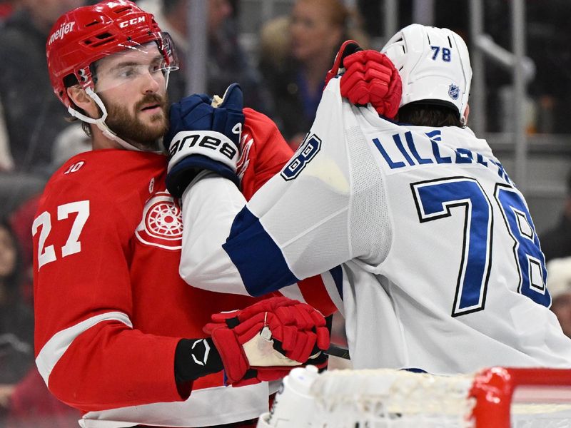 Nov 28, 2025; Detroit, Michigan, USA; Detroit Red Wings center Michael Rasmussen (27) and Tampa Bay Lightning defenseman Emil Lilleberg (78) mix it up behind the Lightning goal in the second period at Little Caesars Arena. Mandatory Credit: Lon Horwedel-Imagn Images