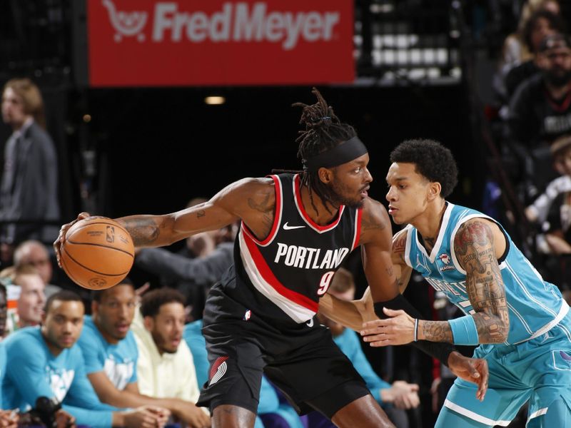 PORTLAND, OR - FEBRUARY 25:  Tre Mann #23 of the  Charlotte Hornets plays defense during the game  against Jerami Grant #9 of the Portland Trail Blazers on February 25, 2024 at the Moda Center Arena in Portland, Oregon. NOTE TO USER: User expressly acknowledges and agrees that, by downloading and or using this photograph, user is consenting to the terms and conditions of the Getty Images License Agreement. Mandatory Copyright Notice: Copyright 2024 NBAE (Photo by Cameron Browne/NBAE via Getty Images)