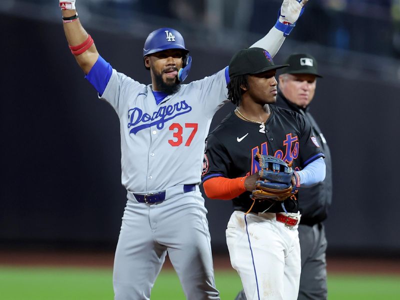 May 23, 2025; New York City, New York, USA; Los Angeles Dodgers right fielder Teoscar Hernandez (37) celebrates his thirteenth inning RBI single against the New York Mets at Citi Field. Mandatory Credit: Brad Penner-Imagn Images