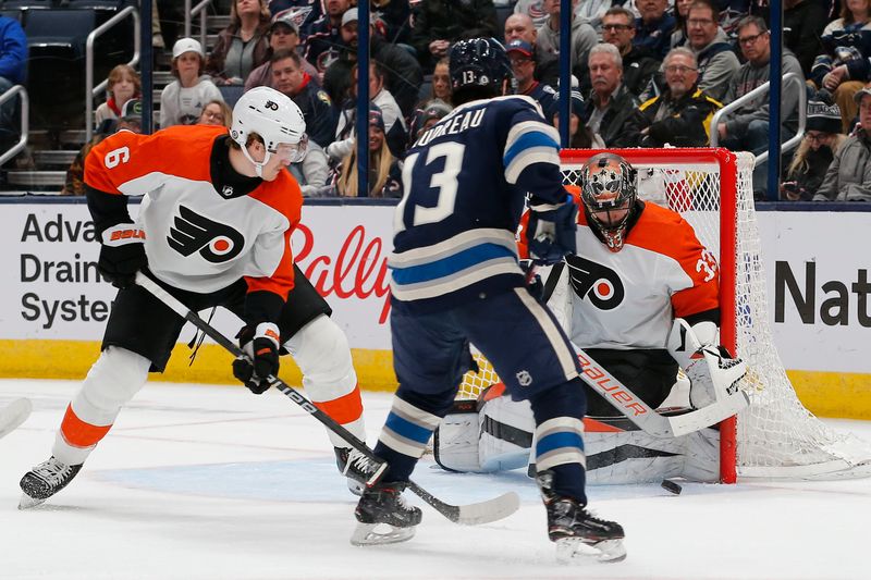 Apr 6, 2024; Columbus, Ohio, USA; Philadelphia Flyers goalie Samuel Ersson (33) makes a save on the shot from Columbus Blue Jackets left wing Johnny Gaudreau (13)
during the first period at Nationwide Arena. Mandatory Credit: Russell LaBounty-USA TODAY Sports