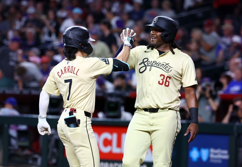 Aug 27, 2024; Phoenix, Arizona, USA; Arizona Diamondbacks outfielder Corbin Carroll (7) celebrates with teammate Josh Bell after hitting a two run home run in the seventh inning against the New York Mets at Chase Field. Mandatory Credit: Mark J. Rebilas-USA TODAY Sports