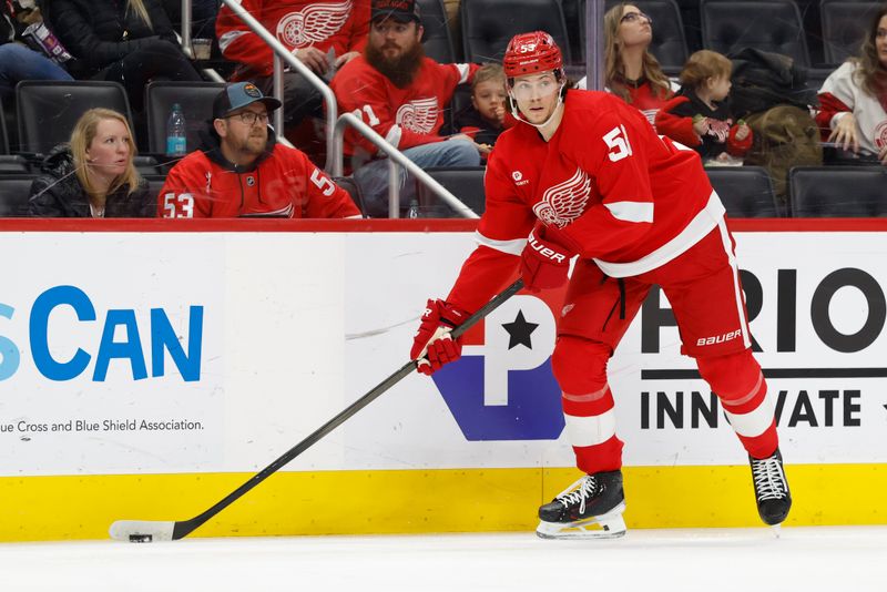 Jan 14, 2025; Detroit, Michigan, USA;  Detroit Red Wings defenseman Moritz Seider (53) skates with the puck in the second period against the San Jose Sharks at Little Caesars Arena. Mandatory Credit: Rick Osentoski-Imagn Images