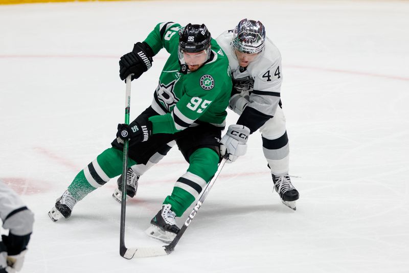 Mar 16, 2024; Dallas, Texas, USA; Dallas Stars center Matt Duchene (95) controls the puck with Los Angeles Kings defenseman Mikey Anderson (44) defending during the second period at American Airlines Center. Mandatory Credit: Andrew Dieb-USA TODAY Sports