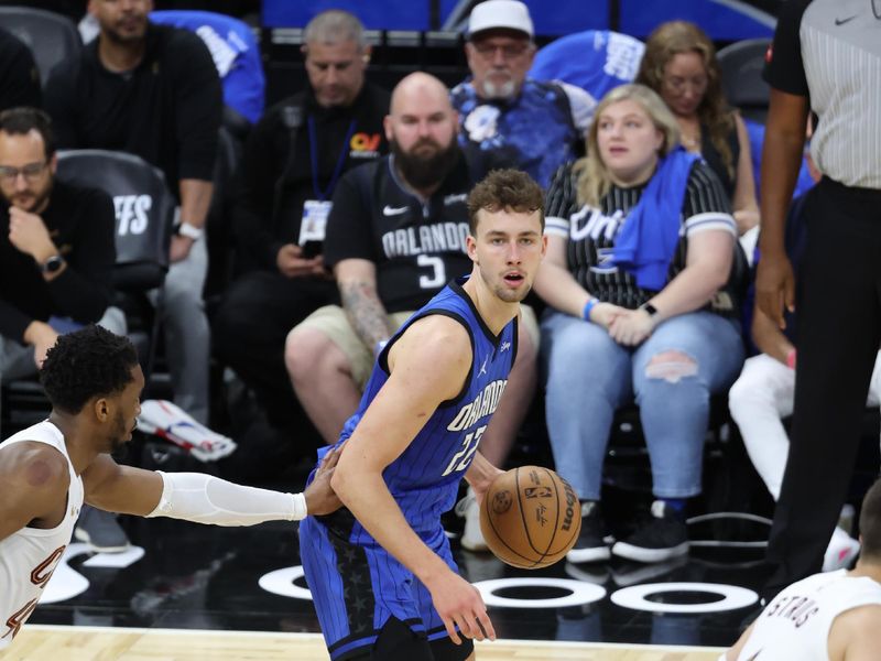 ORLANDO, FL - APRIL 27: Franz Wagner #22 of the Orlando Magic handles the ball during the game against the Cleveland Cavaliers during Round 1 Game 4 of the 2024 NBA Playoffs on April 27, 2024 at the Kia Center in Orlando, Florida. NOTE TO USER: User expressly acknowledges and agrees that, by downloading and or using this photograph, User is consenting to the terms and conditions of the Getty Images License Agreement. Mandatory Copyright Notice: Copyright 2024 NBAE (Photo by David Sherman/NBAE via Getty Images)