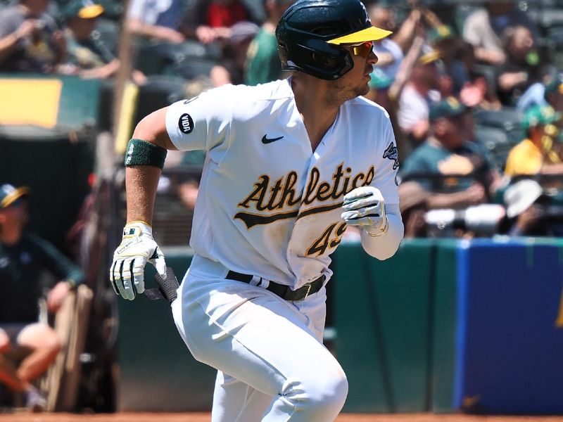 Jun 15, 2023; Oakland, California, USA; Oakland Athletics first baseman Ryan Noda (49) runs to first base on an RBI single against the Tampa Bay Rays during the fifth inning at Oakland-Alameda County Coliseum. Mandatory Credit: Kelley L Cox-USA TODAY Sports