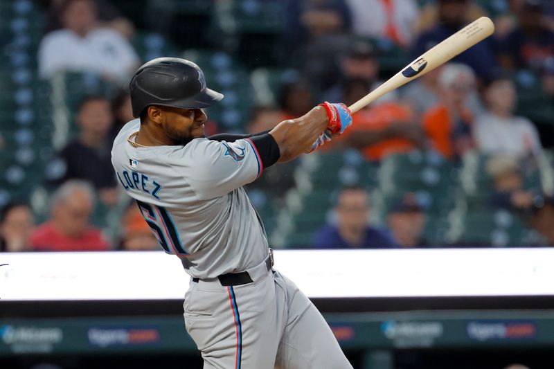 May 13, 2024; Detroit, Michigan, USA;  Miami Marlins third base Otto Lopez (61) hits a two run home run in the eighth inning against the Detroit Tigers at Comerica Park. Mandatory Credit: Rick Osentoski-USA TODAY Sports