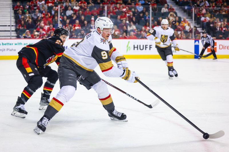 Mar 14, 2024; Calgary, Alberta, CAN; Vegas Golden Knights center Jack Eichel (9) controls the puck against Calgary Flames center Kevin Rooney (21) during the first period at Scotiabank Saddledome. Mandatory Credit: Sergei Belski-USA TODAY Sports