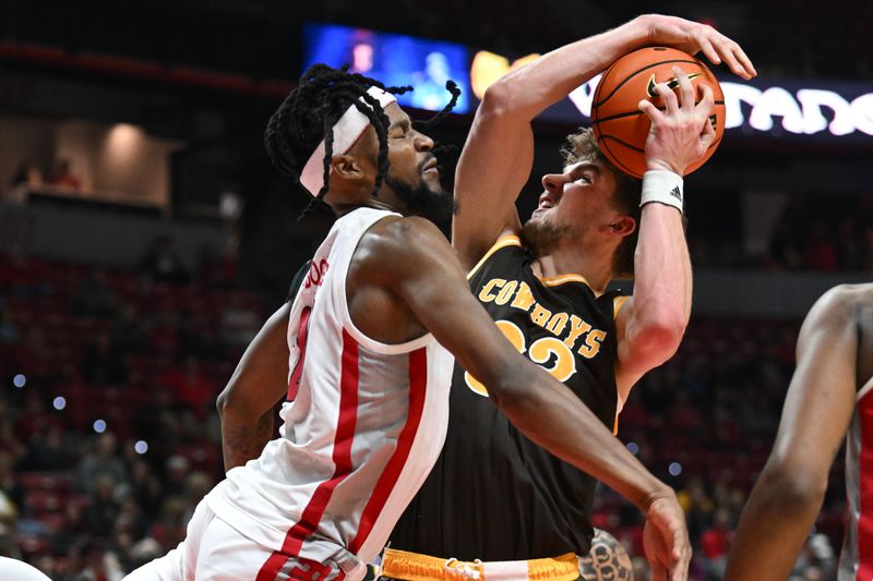 Feb 3, 2024; Las Vegas, Nevada, USA; UNLV Rebels forward Keylan Boone (20) defends against Wyoming Cowboys forward Mason Walters (33) in the second half at Thomas & Mack Center. Mandatory Credit: Candice Ward-USA TODAY Sports