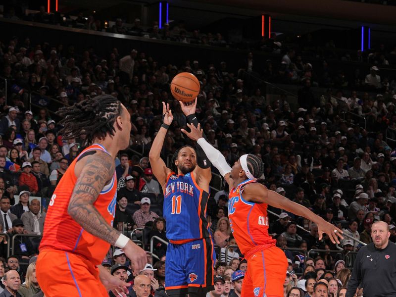 NEW YORK, NY - MARCH 31: Jalen Brunson #11 of the New York Knicks shoots a three point basket during the game against the Oklahoma City Thunder on March 31, 2024 at Madison Square Garden in New York City, New York.  NOTE TO USER: User expressly acknowledges and agrees that, by downloading and or using this photograph, User is consenting to the terms and conditions of the Getty Images License Agreement. Mandatory Copyright Notice: Copyright 2024 NBAE  (Photo by Jesse D. Garrabrant/NBAE via Getty Images)