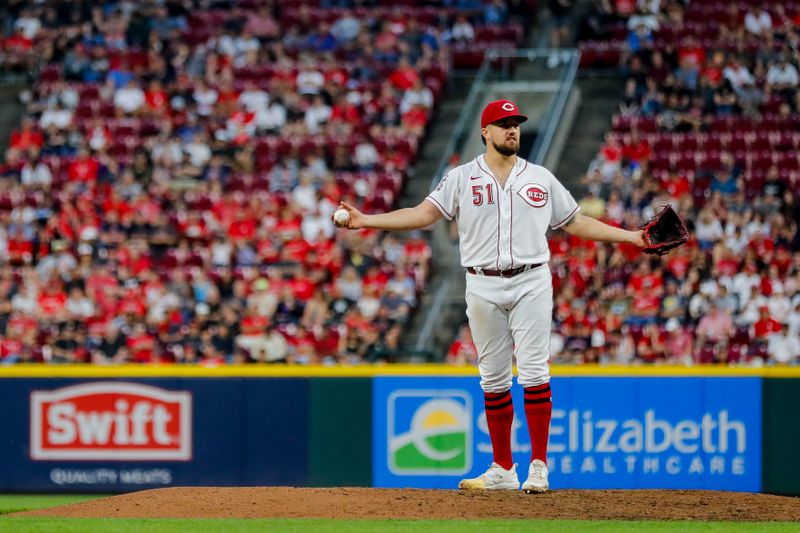 Aug 15, 2023; Cincinnati, Ohio, USA; Cincinnati Reds starting pitcher Graham Ashcraft (51) reacts after a play against the Cleveland Guardians in the seventh inning at Great American Ball Park. Mandatory Credit: Katie Stratman-USA TODAY Sports