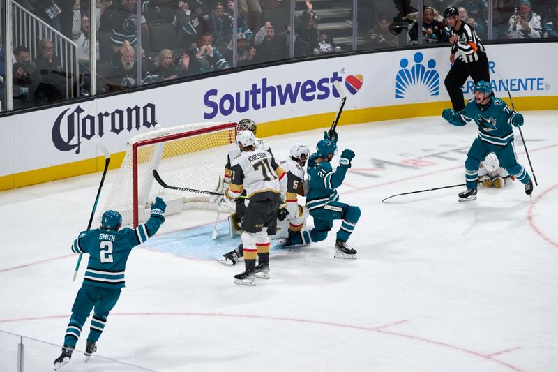 Oct 9, 2025; San Jose, California, USA; San Jose Sharks center Alexander Wennberg (21) celebrates with defenseman Will Smith (2) and left wing William Eklund (72) after scoring a goal against Vegas Golden Knights goaltender Akira Schmid (40) (obscured) during the second period at SAP Center at San Jose. Mandatory Credit: Robert Edwards-Imagn Images