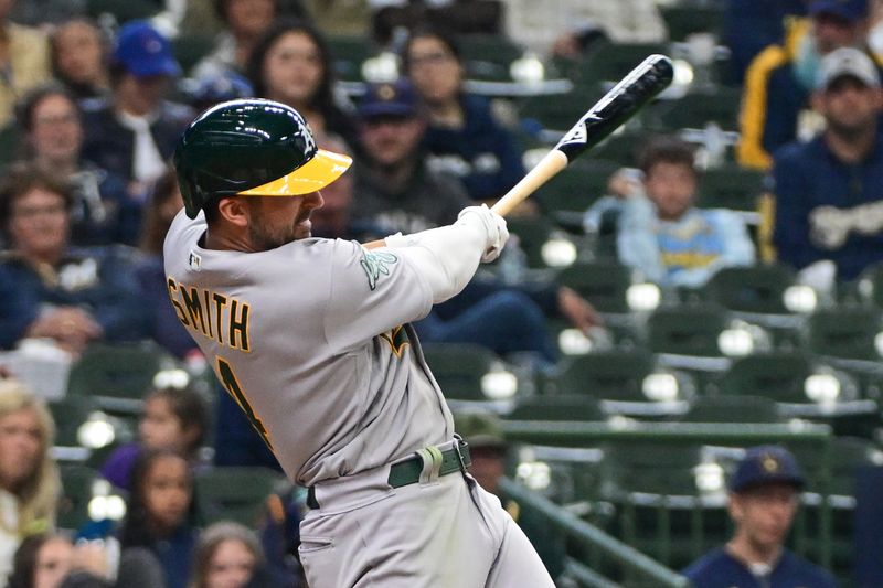 Jun 11, 2023; Milwaukee, Wisconsin, USA; Oakland Athletes shortstop Kevin Smith (4) hits a solo home run against the Milwaukee Brewers in the seventh inning at American Family Field. Mandatory Credit: Benny Sieu-USA TODAY Sports