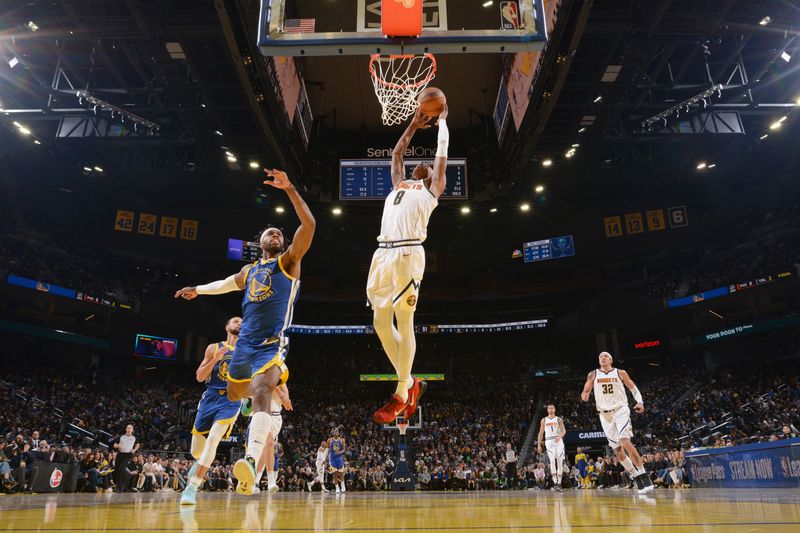 SAN FRANCISCO, CA - MARCH 17: Peyton Watson #8 of the Denver Nuggets drives to the basket during the game against the Golden State Warriors on March 17, 2025 at Chase Center in San Francisco, California. NOTE TO USER: User expressly acknowledges and agrees that, by downloading and or using this photograph, user is consenting to the terms and conditions of Getty Images License Agreement. Mandatory Copyright Notice: Copyright 2025 NBAE (Photo by Noah Graham/NBAE via Getty Images)