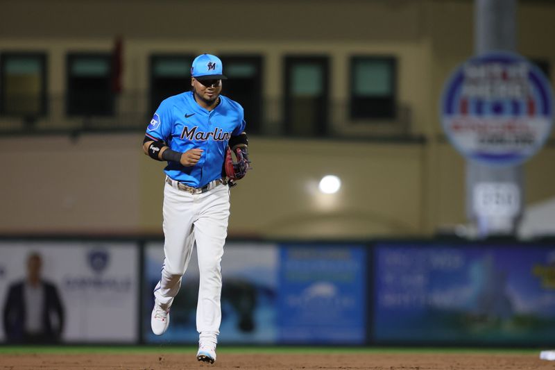 Mar 4, 2024; Jupiter, Florida, USA; Miami Marlins second baseman Luis Arraez (3) runs on the field against the New York Yankees during the third inning at Roger Dean Chevrolet Stadium. Mandatory Credit: Sam Navarro-USA TODAY Sports