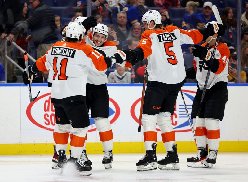 Nov 3, 2023; Buffalo, New York, USA;  Philadelphia Flyers defensemen Louie Belpedio (37) celebrates his goal with teammates during the first period against the Buffalo Sabres at KeyBank Center. Mandatory Credit: Timothy T. Ludwig-USA TODAY Sports