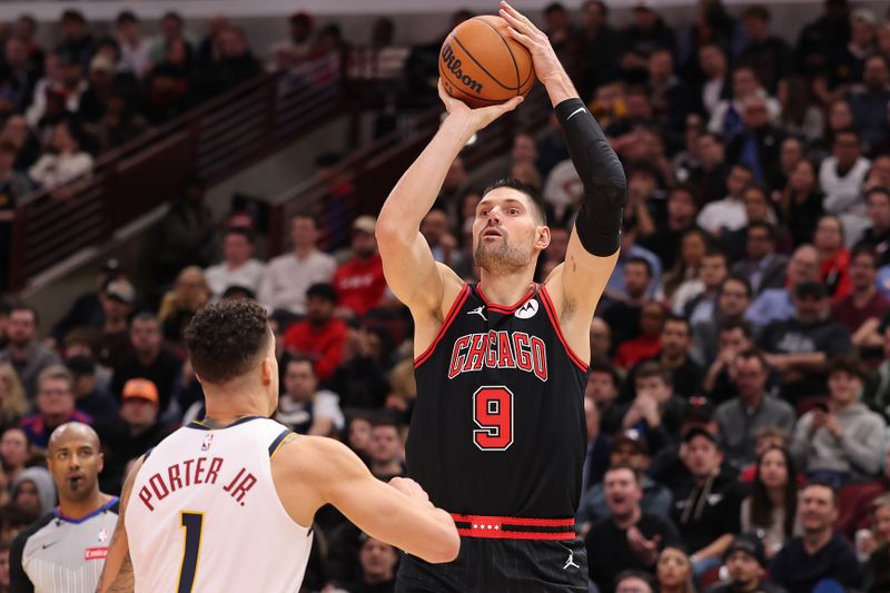 CHICAGO, ILLINOIS - JANUARY 27: Nikola Vucevic #9 of the Chicago Bulls shoots over Michael Porter Jr. #1 of the Denver Nuggets during the second half at the United Center on January 27, 2025 in Chicago, Illinois. NOTE TO USER: User expressly acknowledges and agrees that, by downloading and or using this photograph, User is consenting to the terms and conditions of the Getty Images License Agreement.  (Photo by Michael Reaves/Getty Images)