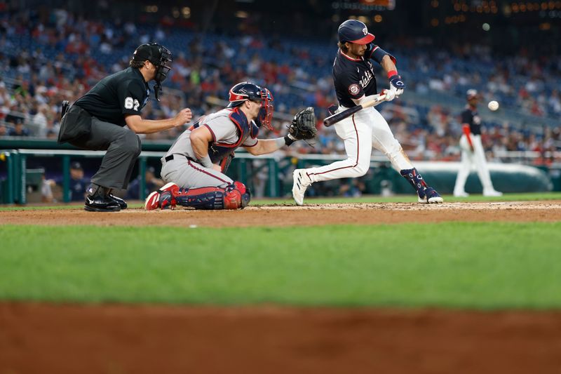 Sep 11, 2024; Washington, District of Columbia, USA; Washington Nationals outfielder Dylan Crews (3) hits an RBI single against the Atlanta Braves during the third inning at Nationals Park. Mandatory Credit: Geoff Burke-Imagn Images