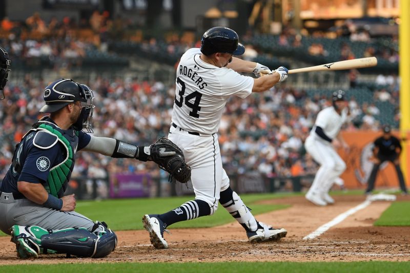 Aug 13, 2024; Detroit, Michigan, USA;  Detroit Tigers catcher Jake Rogers (34) hits a grand slam home run against the Seattle Mariners in the fourth inning at Comerica Park. Mandatory Credit: Lon Horwedel-USA TODAY Sports