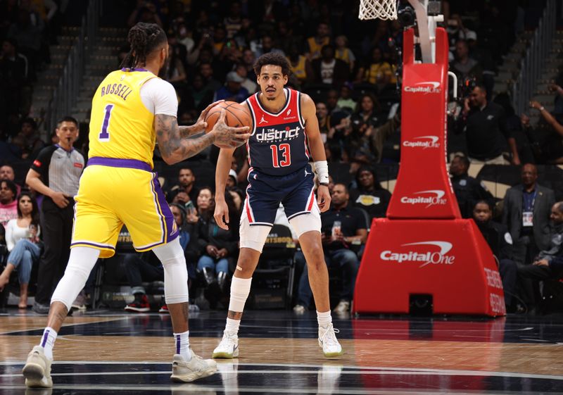 WASHINGTON, DC -? APRIL 3: Jordan Poole #13 of the Washington Wizards plays defense against D'Angelo Russell #1 of the Los Angeles Lakers during the game on April 3, 2024 at Capital One Arena in Washington, DC. NOTE TO USER: User expressly acknowledges and agrees that, by downloading and or using this Photograph, user is consenting to the terms and conditions of the Getty Images License Agreement. Mandatory Copyright Notice: Copyright 2024 NBAE (Photo by Stephen Gosling/NBAE via Getty Images)