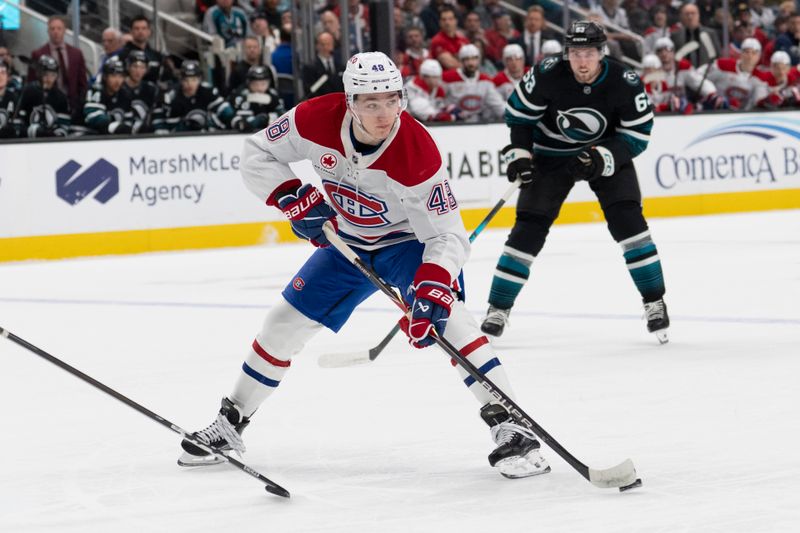 Mar 3, 2026; San Jose, California, USA;  Montreal Canadiens defenseman Lane Hutson (48) looks to pass the puck during the first period against the San Jose Sharks at SAP Center at San Jose. Mandatory Credit: Stan Szeto-Imagn Images