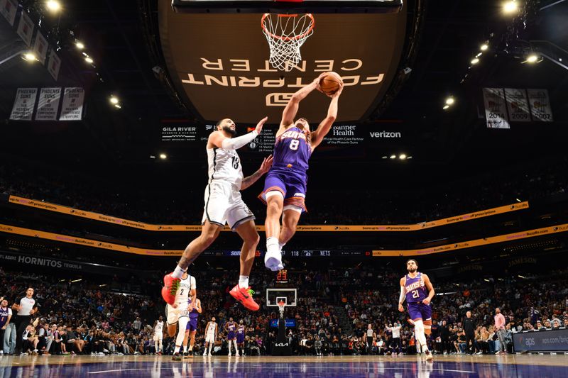 PHOENIX, AZ - NOVEMBER 27: Grayson Allen #8 of the Phoenix Suns dunks the ball during the game against the Brooklyn Nets on November 27, 2024 at Footprint Center in Phoenix, Arizona. NOTE TO USER: User expressly acknowledges and agrees that, by downloading and or using this photograph, user is consenting to the terms and conditions of the Getty Images License Agreement. Mandatory Copyright Notice: Copyright 2024 NBAE (Photo by Barry Gossage/NBAE via Getty Images)