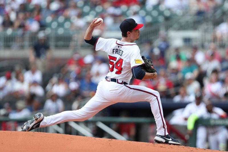 Aug 4, 2024; Cumberland, Georgia, USA; Atlanta Braves starting pitcher Max Fried (54) pitches against the Miami Marlins in the first inning at Truist Park. Mandatory Credit: Mady Mertens-USA TODAY Sports