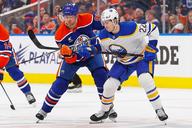 Jan 25, 2025; Edmonton, Alberta, CAN; Buffalo Sabres forward Jack Quinn (22) and Edmonton Oilers forward Corey Perry (90) battles for position during the third period at Rogers Place. Mandatory Credit: Perry Nelson-Imagn Images