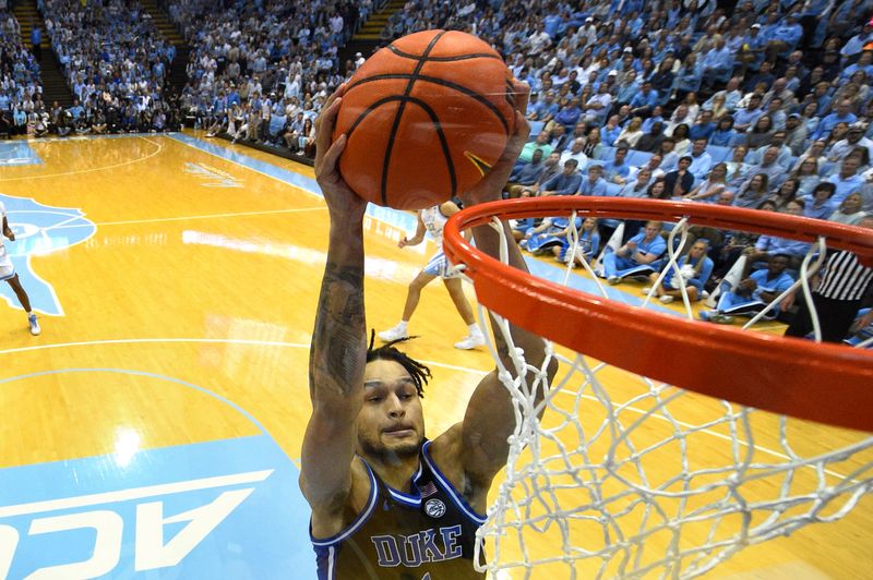 Mar 4, 2023; Chapel Hill, North Carolina, USA; Duke Blue Devils center Dereck Lively II (1) with the ball in the second half at Dean E. Smith Center. Mandatory Credit: Bob Donnan-USA TODAY Sports