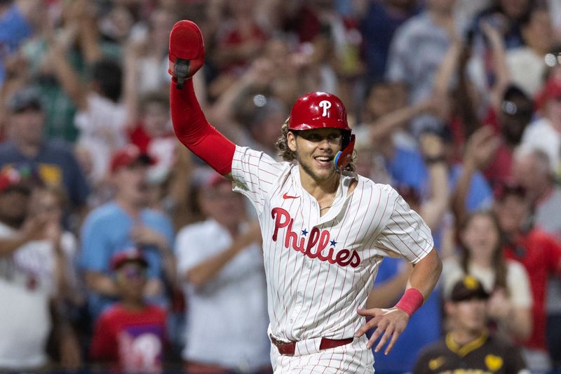 Jun 18, 2024; Philadelphia, Pennsylvania, USA; Philadelphia Phillies third base Alec Bohm (28) reacts as he runs home to score the game winning run during the ninth inning against the San Diego Padres at Citizens Bank Park. Mandatory Credit: Bill Streicher-USA TODAY Sports