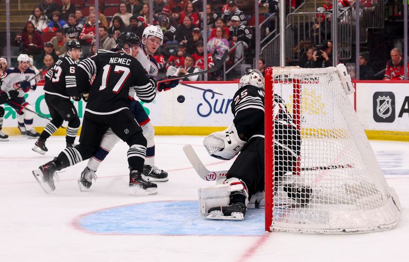 Feb 3, 2026; Newark, New Jersey, USA; New Jersey Devils goaltender Jacob Markstrom (25) makes a save against the Columbus Blue Jackets during the first period at Prudential Center. Mandatory Credit: Ed Mulholland-Imagn Images