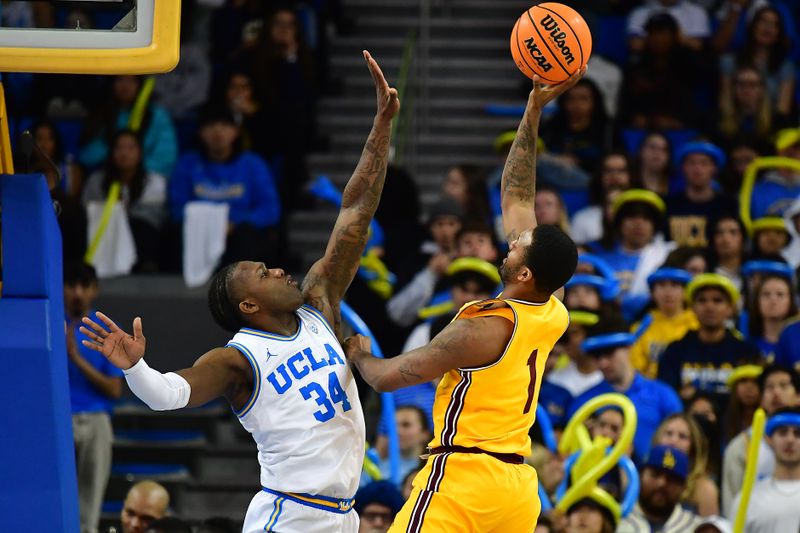 Mar 2, 2023; Los Angeles, California, USA; Arizona State Sun Devils guard Luther Muhammad (1) shoots against UCLA Bruins guard David Singleton (34) during the second half at Pauley Pavilion. Mandatory Credit: Gary A. Vasquez-USA TODAY Sports