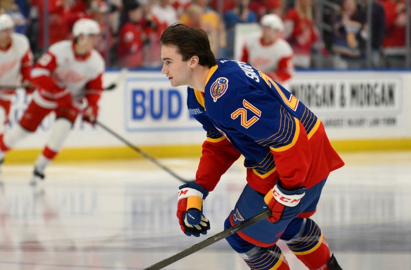 Apr 1, 2025; St. Louis, Missouri, USA; St. Louis Blues right wing Jimmy Snuggerud (21) skates his rookie lap before his NHL debut against the Detroit Red Wings at Enterprise Center. Mandatory Credit: Jeff Le-Imagn Images