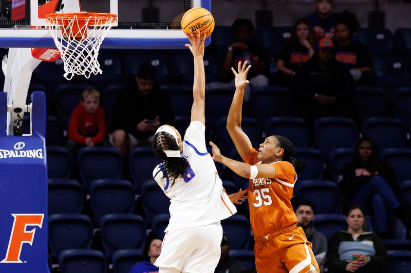 Jan 29, 2026; Gainesville, Florida, USA; Florida Gators forward Me'arah O'Neal (8) blocks a shot from Texas Longhorns forward Madison Booker (35) during the first half at Exactech Arena at the Stephen C. O'Connell Center. Mandatory Credit: Matt Pendleton-Imagn Images
