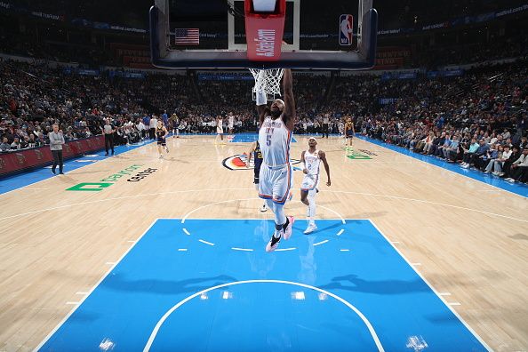 OKLAHOMA CITY, OK - DECEMBER 8: Luguentz Dort #5 of the Oklahoma City Thunder dunks the ball during the game against the Golden State Warriors on December 8, 2023 at Paycom Arena in Oklahoma City, Oklahoma. NOTE TO USER: User expressly acknowledges and agrees that, by downloading and or using this photograph, User is consenting to the terms and conditions of the Getty Images License Agreement. Mandatory Copyright Notice: Copyright 2023 NBAE (Photo by Zach Beeker/NBAE via Getty Images)