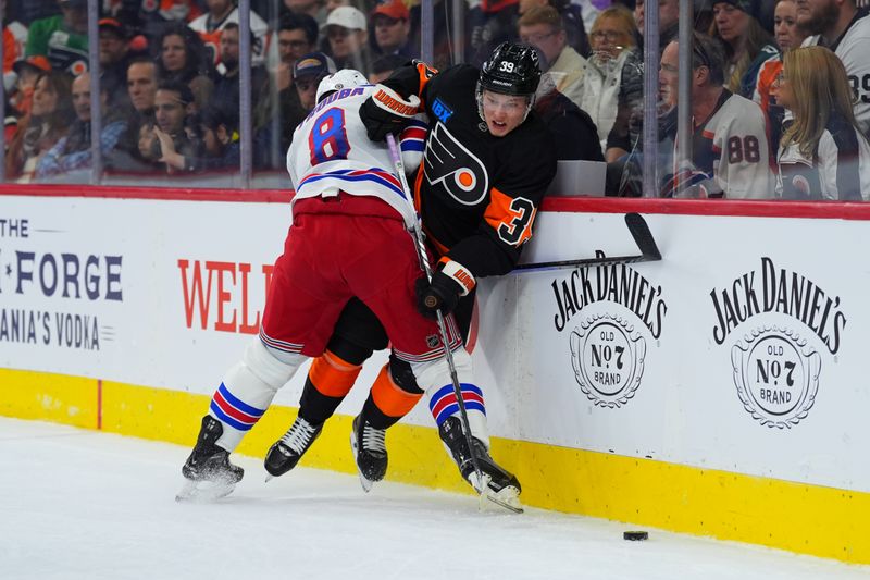 Nov 29, 2024; Philadelphia, Pennsylvania, USA; New York Rangers defenseman Jacob Trouba (8) hits Philadelphia Flyers right wing Matvei Michkov (39) in the first period at Wells Fargo Center. Mandatory Credit: Kyle Ross-Imagn Images